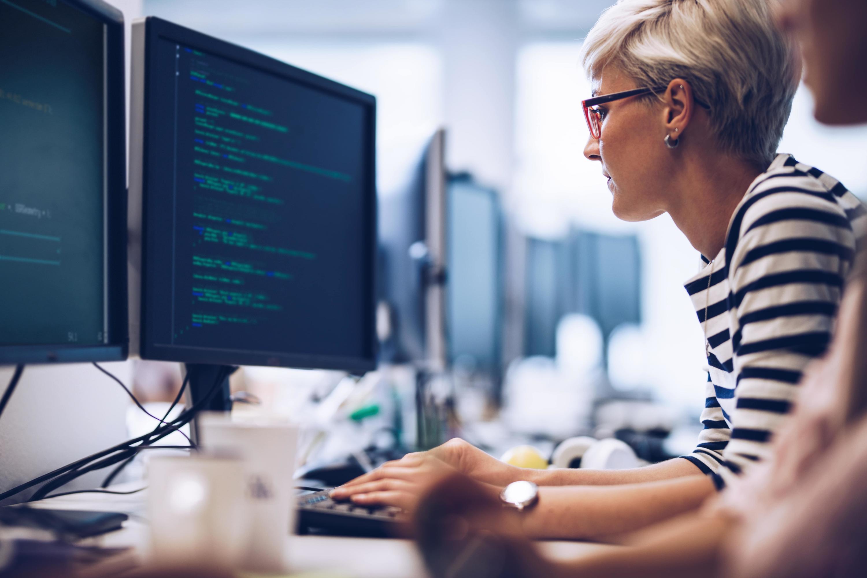 photo of a woman working on a computer