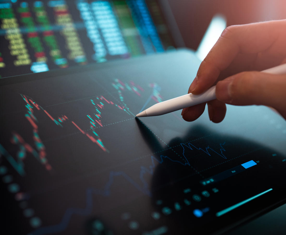 Market Analyze with Digital Monitor focus on tip of finger