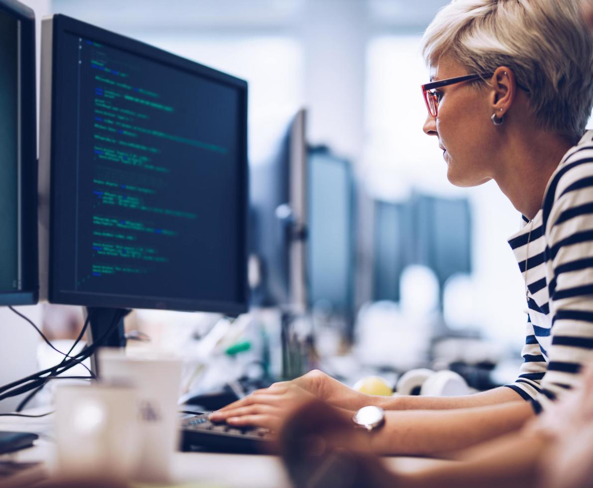 photo of a woman working on a computer